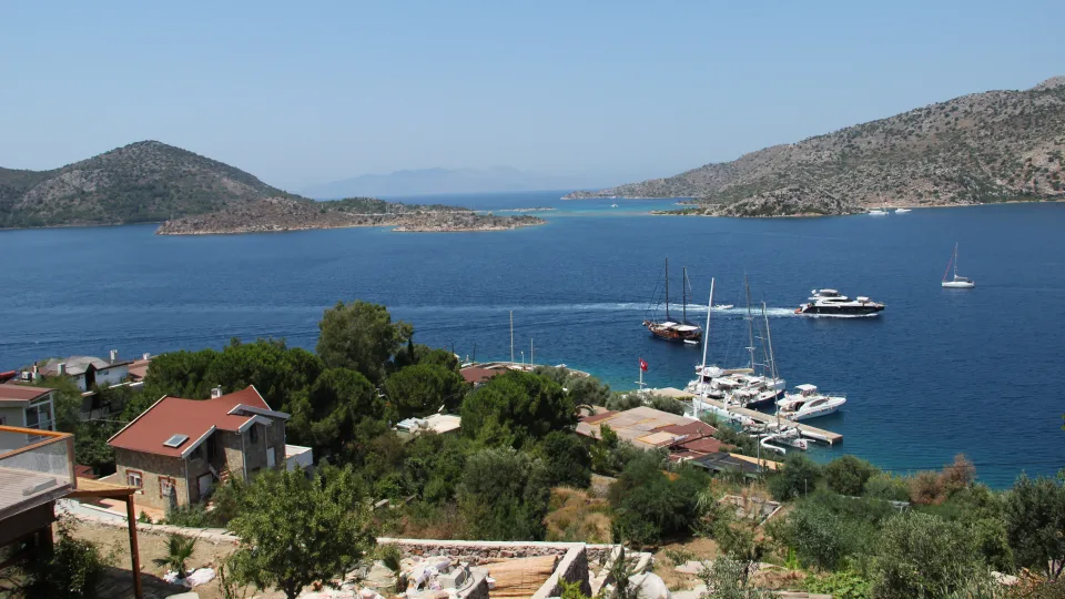 Sailing boats, catamarans and coastal hills beside Bozburun.