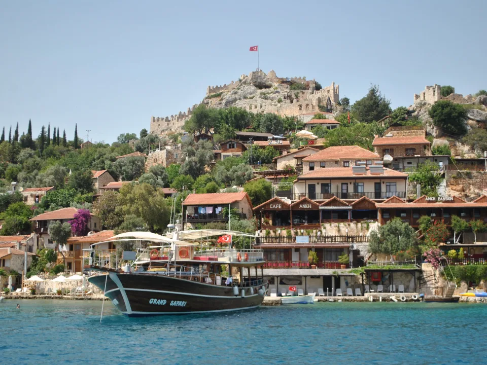 Boats and waterfront houses below Kaleköy Castle in Demre district.